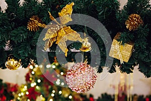 Beautiful decorated Christmas tree background with bauble and xmas ornaments blurred in bokeh home