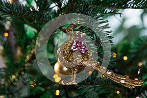 Beautiful decorated Christmas tree. with various hanging Christmas balls on the tree, Christmas background, gold and pink balls