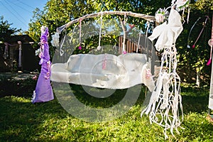 Beautiful decorated for wedding swing at backyard