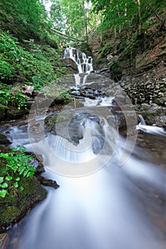 beautiful deep forest waterfall