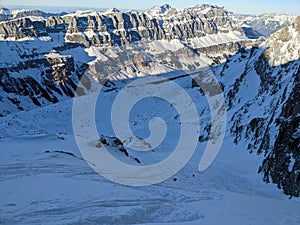 beautiful deep snow tracks from the teufelsjoch mountain down towards the glacier firn. Uri Glarus Switzerland