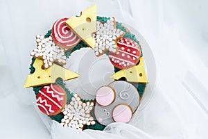 Beautiful and delicious gingerbread with pieces of cheese, mouse, balls for the Christmas tree