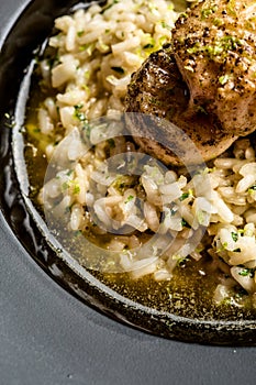 Beautiful and delicious risotto with fish medallions. Gourmet dish