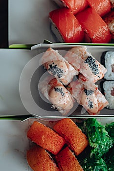 Beautiful delicious sushi. Sushi delivery. Advertising sushi rolls made of fish and cheese.