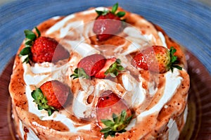 Several strawberries on whipped cream cake photo