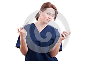 Beautiful dentist woman holding syringe and anesthetic