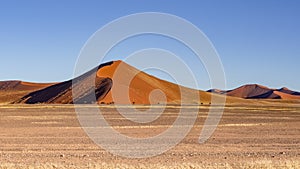 Desert landscape, red sand dunes in Sossusvlei, Namib-Naukluft National Park, Namibia