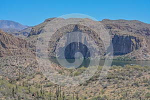 Beautiful desert rock formations line this secluded, Canyon Lake in Tortilla Flat, Tonto National Forest, Arizona