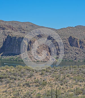 Beautiful desert rock formations line this secluded, Canyon Lake in Tortilla Flat, Tonto National Forest, Arizona