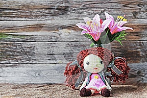 Beautiful designed doll with plastic flowers