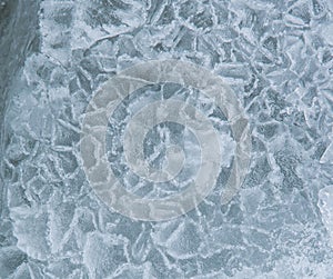 Beautiful designs of winter ice on the lake.