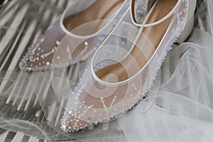 Beautiful detail close up white woman wedding shoes