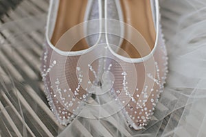 Beautiful detail close up white woman wedding shoes