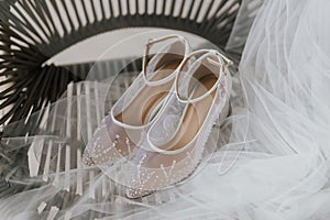 Beautiful detail close up white woman wedding shoes