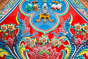 Beautiful detail of handmade Chinese style flower ceramic mosaic tile background in Chinese temple