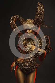 Beautiful devil women with golden ornamental horns