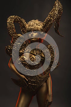 Beautiful devil women with golden ornamental horns