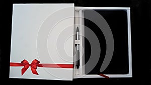 Beautiful diary gifting with wonderful red ribbon design and pen