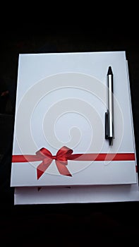 Beautiful diary gifting with wonderful red ribbon design and pen