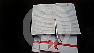 Beautiful diary gifting with wonderful red ribbon design and pen