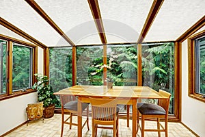 Beautiful dining area with transparant glass wall photo