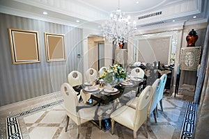 Beautiful dining room with Chandelier in a mansion photo