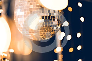 beautiful disco ball with golden garland