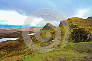 Beautiful display of the landslip, hill Quiraing with mountain trails in Scotland photo