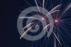 Beautiful display of vibrant fireworks bursting against a dark night sky