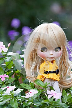 Beautiful doll in the garden