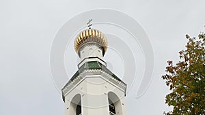 Beautiful domes with a church cross against the background of the sky and trees in summer, religion. Copy space for text