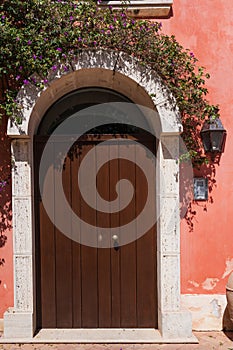 Beautiful door decorated with flowers in italy