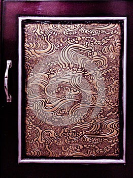 A BEAUTIFUL DOOR OF A DRESSING TABLE WITH AMAZING ART WORK