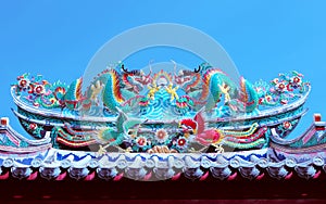 Beautiful dragon statue decorated on chinese temple roof against