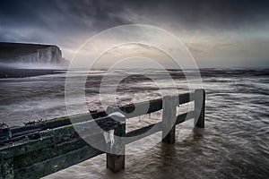 Beautiful dramatic foggy Winter sunrise Seven Sisters cliffs lan