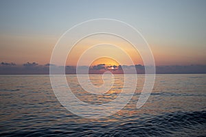 Beautiful Dramatic Golden Sky Over the Sea and Reflection During Sunset in Summer, long Exposure. Sunrise in Pastel Colors in