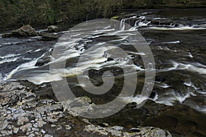 Beautiful dramatic landscape image of Aysgarth Falls in Yorkshire Dales in England during Winter morning