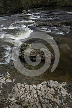 Beautiful dramatic landscape image of Aysgarth Falls in Yorkshire Dales in England during Winter morning