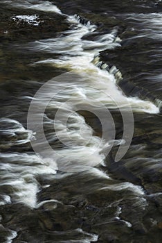 Beautiful dramatic landscape image of Aysgarth Falls in Yorkshire Dales in England during Winter morning