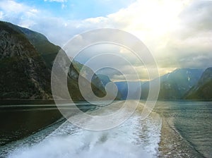 Beautiful and dramatic Norway landscape with mountains and sea in fjord