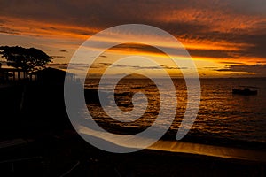 Beautiful dramatic orange sunset on a beach