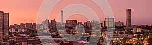 A beautiful and dramatic panoramic photograph of the Johannesburg inner city skyline