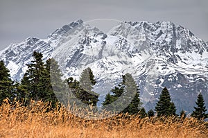 Beautiful dramatic scenic snowy mountain peak autumn landscape. Agepsta Peak, Caucasus mountains, Sochi, Russia