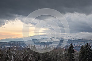 Beautiful dramatic sunset evening over town Banska Bystrica, Slovakia, Central Europe. Darkening sky.