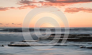 Beautiful dramatic Sunset over a rocky coast