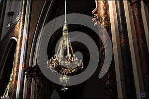 Beautiful drawings on the pillars and golden chandelier in the Church of the Sacred Heart, Spain