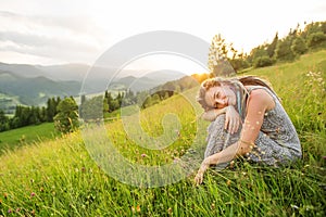 Beautiful dreadlock woman in mountains