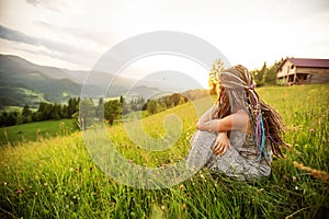 Beautiful dreadlock woman in mountains