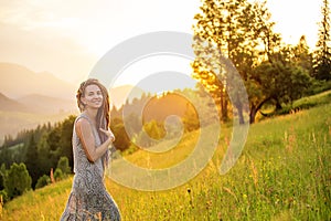 Beautiful dreadlock woman in mountains