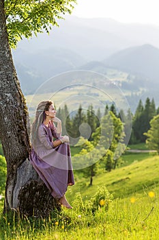Beautiful dreadlock woman in mountains